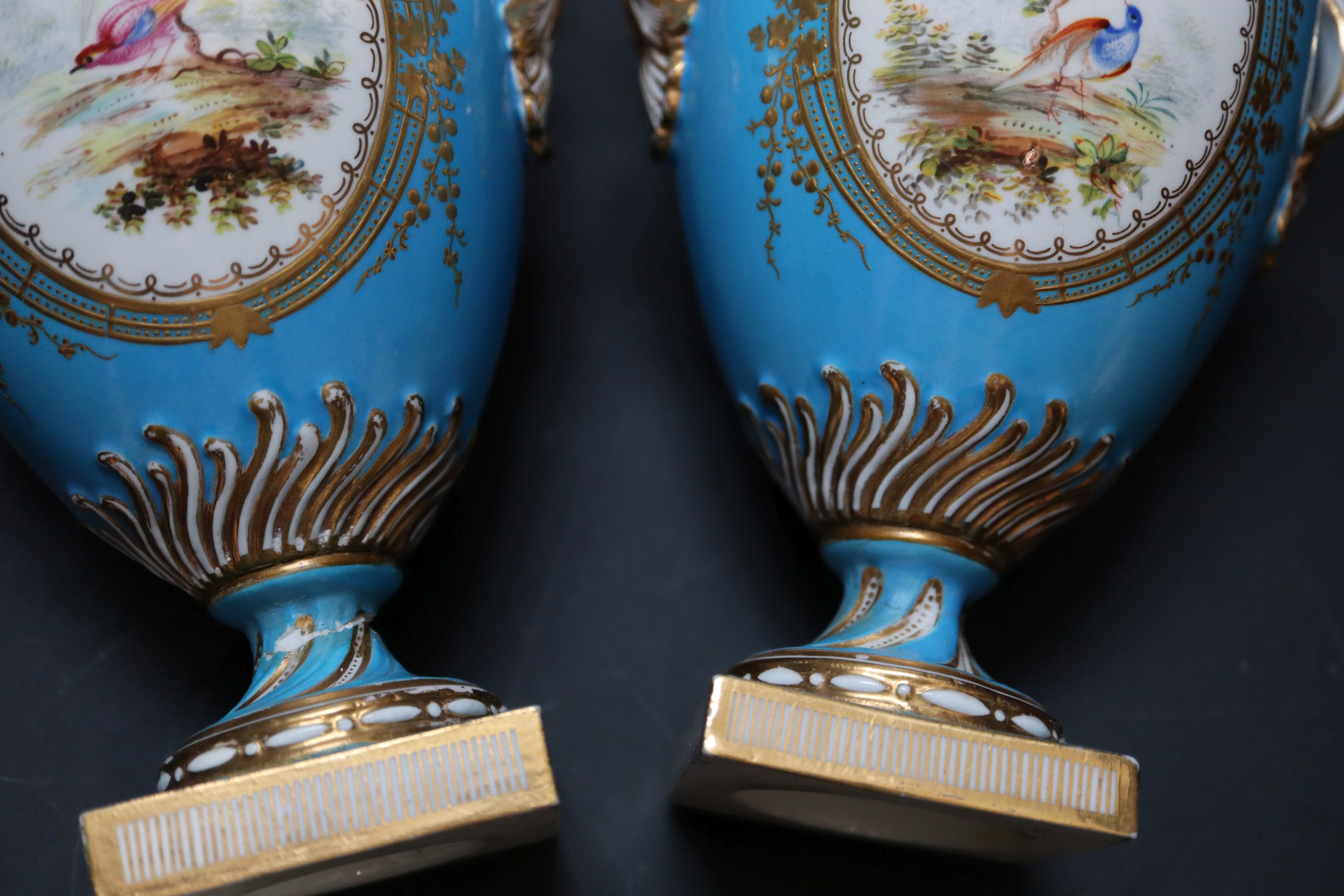 A pair of mid 19th century Coalport turquoise ground two handled vases, height 21cm.